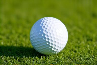 A golf ball sitting perfectly on the fairway, representing forgiveness.