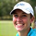 Headshot of Emily, a casual golfer enjoying her game.