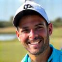 Headshot of Juan, a golfer demonstrating enthusiasm.